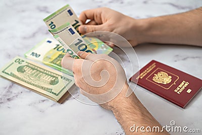 Passport of the Russian Federation and euro and dollar banknotes Editorial Stock Photo