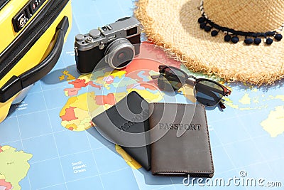 Passports and tourist items on world map Stock Photo