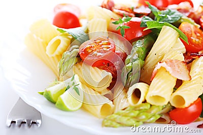 Pasta with asparagus and bacon Stock Photo