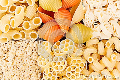 Pasta background assortment of different kinds italian macaroni in chess cells top view. Stock Photo
