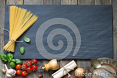 Pasta basil tomato garlic food abstract background concept on black marble Stock Photo