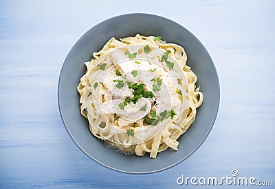 Pasta fettuccine alfredo with chicken, parmesan and parsley Stock Photo