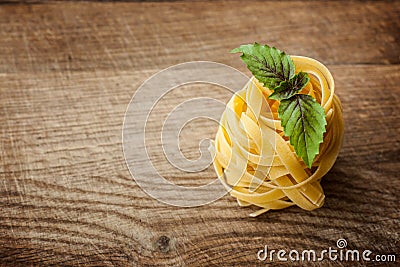 Pasta fresh basil on wood Stock Photo