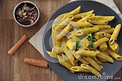 Vegetarian indian pasta with palak sauce. Green pasta. Stock Photo