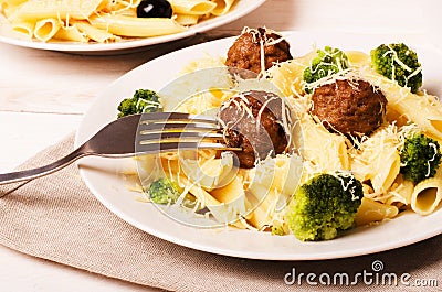 Pasta penne with meatballs and broccoli Stock Photo