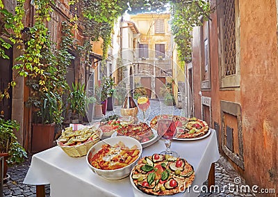 Pasta , pizza and homemade food arrangement in a restaurant Rome Stock Photo