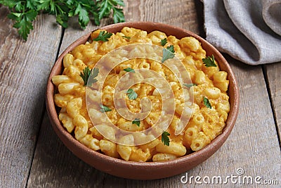 Pasta with pumpkin and cheese creamy in pottery Stock Photo