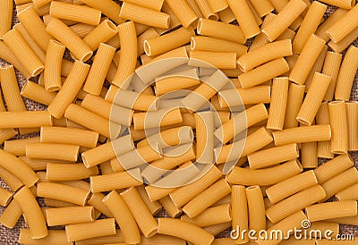 Pasta rigatoni texture, heap of Italian pasta Stock Photo