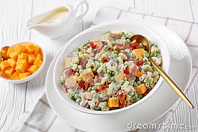 Pasta salad with green peas, fried bacon Stock Photo