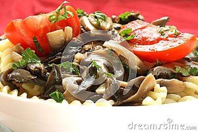 Pasta salad with mushrooms and organic tomato Stock Photo