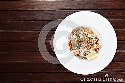 Pasta with seafood and parmesan cheese exists on a wooden background Stock Photo