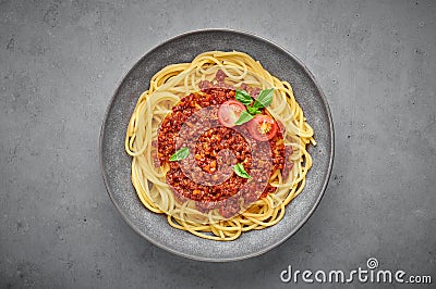 Pasta Spaghetti Bolognese in gray bowl on concrete background. Bolognese sauce is classic italian cuisine dish Stock Photo