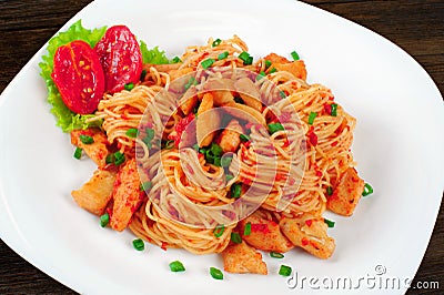 Pasta. Spaghetti with sauce and chicken on a plate. Stock Photo