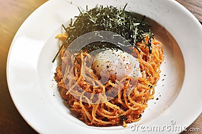 Pasta spicy garlic and mentaiko with soft boiled egg. Stock Photo