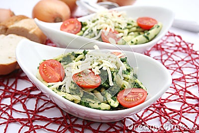 Pasta with spinach and tomatoes Stock Photo