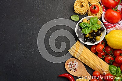 Pasta, vegetables, herbs and spices for Italian food on black background. Stock Photo