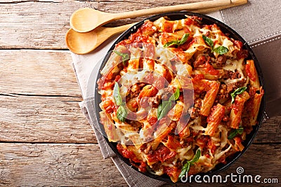 Pasta ziti with bolognese sauce and cheese close-up. horizontal Stock Photo