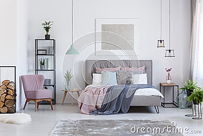 Pastel bedroom with comfortable chair Stock Photo