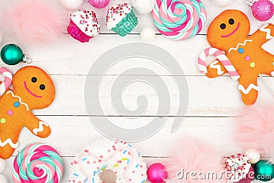 Pastel Christmas sweets decor, frame over white wood Stock Photo