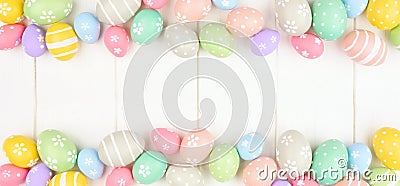 Easter banner with double border of pastel Easter Eggs over a white wood background with copy space Stock Photo