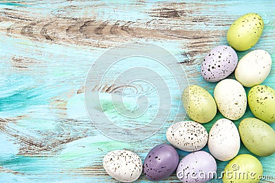 Pastel colored easter eggs on wooden background Stock Photo