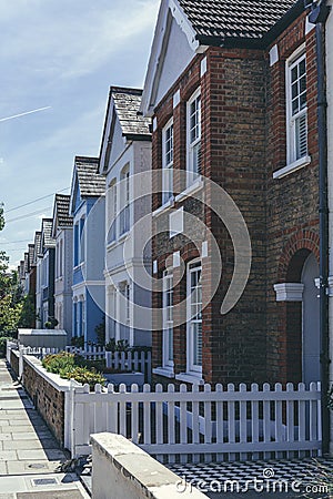 Pastel-colored terraced houses on White Hart Lane in Barnes, London Editorial Stock Photo