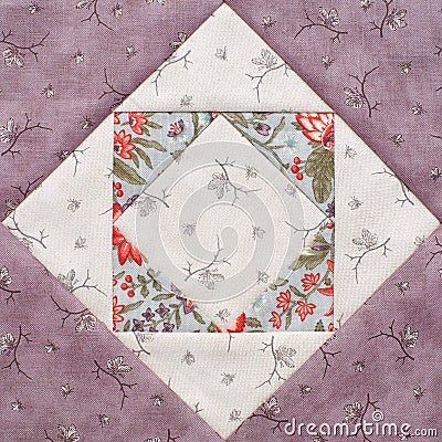 Pastel geometric patchwork block from pieces of fabrics, detail of quilt, close-up Stock Photo