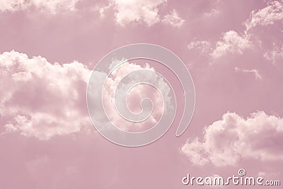 Pastel pink sky with white fluffy clouds Stock Photo