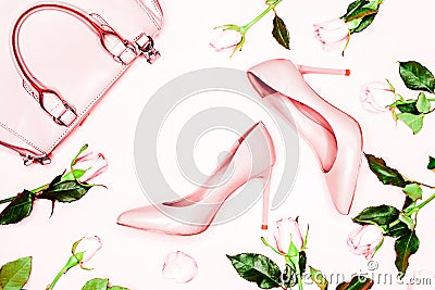 Pastel pink women high heel shoes and bag on pink background. Flat lay, top view trendy fashion feminine background. Beauty blog c Stock Photo