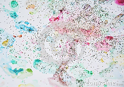 Pastel sparkling watercolor paint in yellow, pink, violet and blue hues Stock Photo