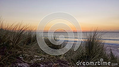 Pastel Sunrise over the Ocean Stock Photo