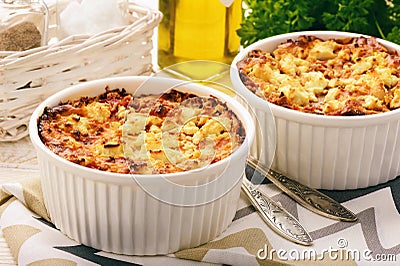 Pastitsio -greek casserole with pasta, meat, tomatoes and feta cheese. Stock Photo