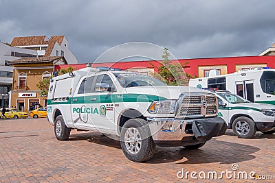 PASTO, COLOMBIA - JULY 3, 2016: white and green police pickup parked next to some othe police vehicles Editorial Stock Photo