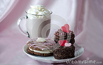 pastries and mug of chocolate mocha frappuccino with whipped cream Stock Photo