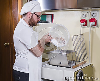 Pastry chef prepares hazelnut cake Stock Photo