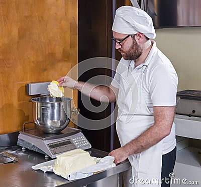 Pastry chef prepares hazelnut cake Stock Photo