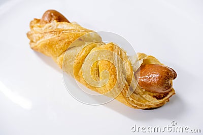 Pastry sausage puff on white Stock Photo