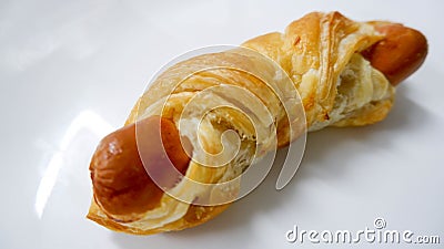 Pastry sausage puff on white Stock Photo