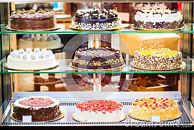 Pastry shop in glass cabinet display Stock Photo