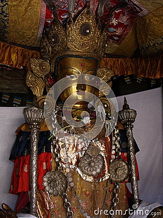 Golden metal Buddha sculpture inside Hiranya Varna Mahavihar. Golden Temple. Patan, Kathmandu. Nepal Stock Photo