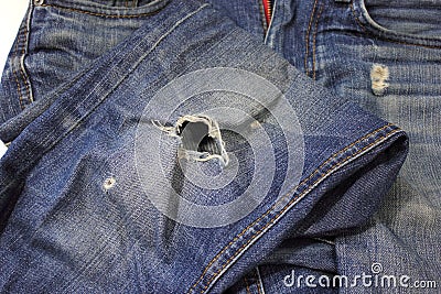 Patch a hole in the jeans Stock Photo