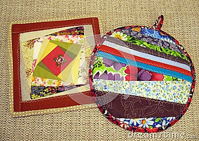 Patchwork of scraps and threads. Square and round napkin with decorative fabric patches . Stock Photo