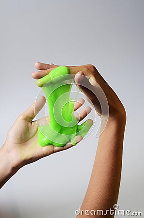 Pate slime elastic and viscous on child`s hand Stock Photo