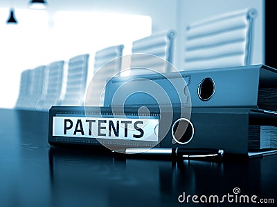 Patents on Ring Binder. Toned Image. 3D. Stock Photo