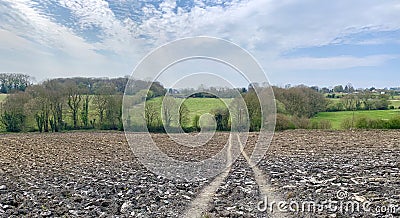 Path across ploughed field Stock Photo