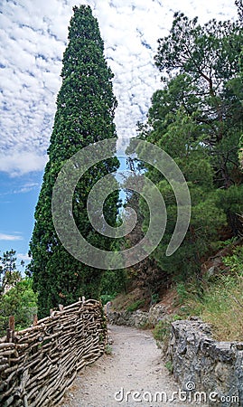 The path along the coast to the mountain steep cliff Stock Photo