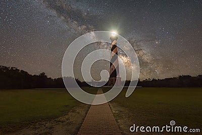 Path leading to Cape Hatteras Light and The Milky Way Galaxy. Stock Photo