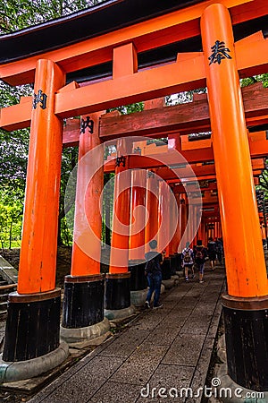 Path lined with giant Torii gates at the Fushimi Inari temple, Kyoto, Japan Editorial Stock Photo