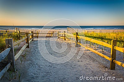 Path over sand dunes to the Atlantic Ocean at sunrise in Ventnor City, New Jersey. Stock Photo