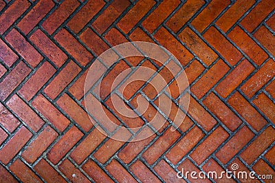 The path paved with red brick in herringbone pattern, Red stone walkway herringbone style pattern Stock Photo